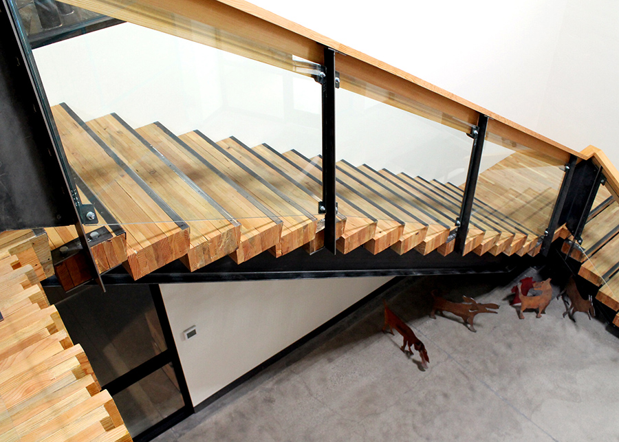Looking down from the custom nail-laminated timber staircase